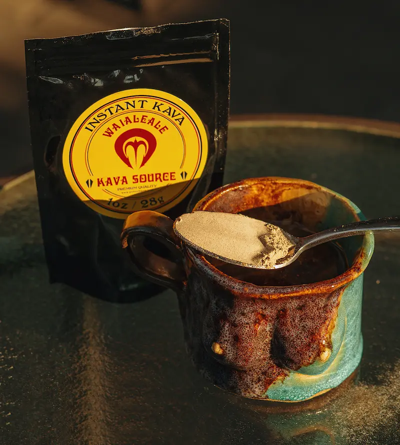 DoubleBlind: Bag of Potent Kava extract with a spoon full of kava resting on top of a mug.