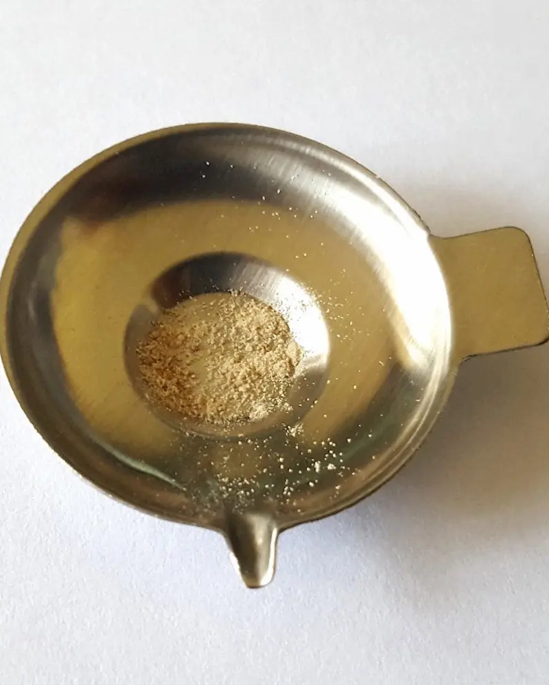 DoubleBlind: Metal tray holding 4-aco-dmt powder.