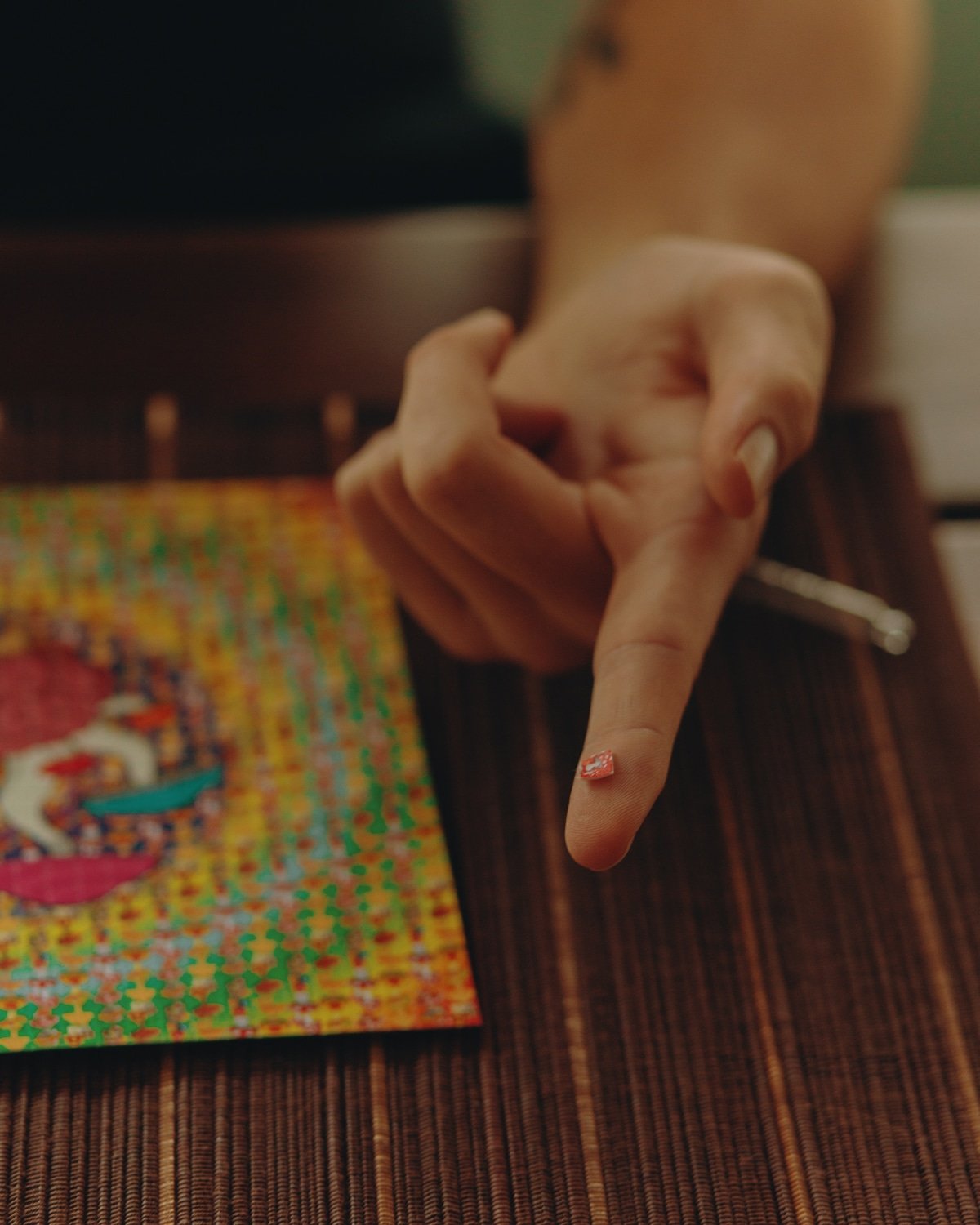 LSD tab on finger