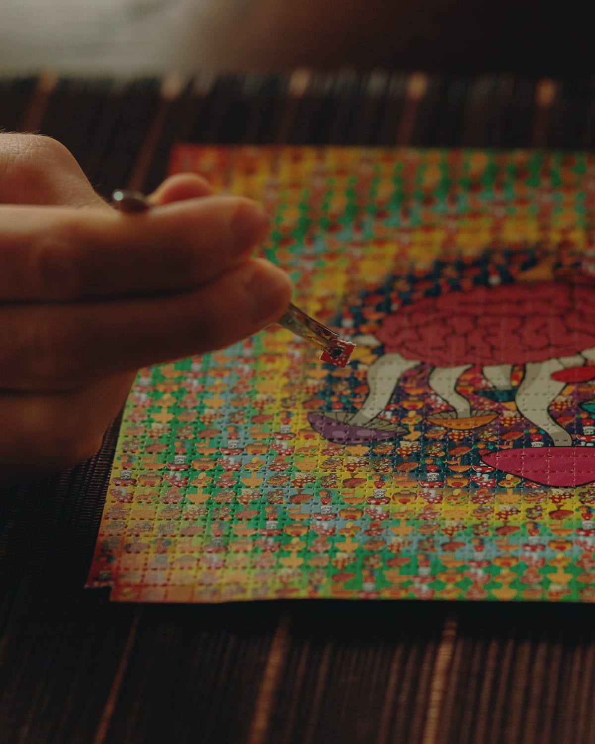 tweezers holding LSD tab