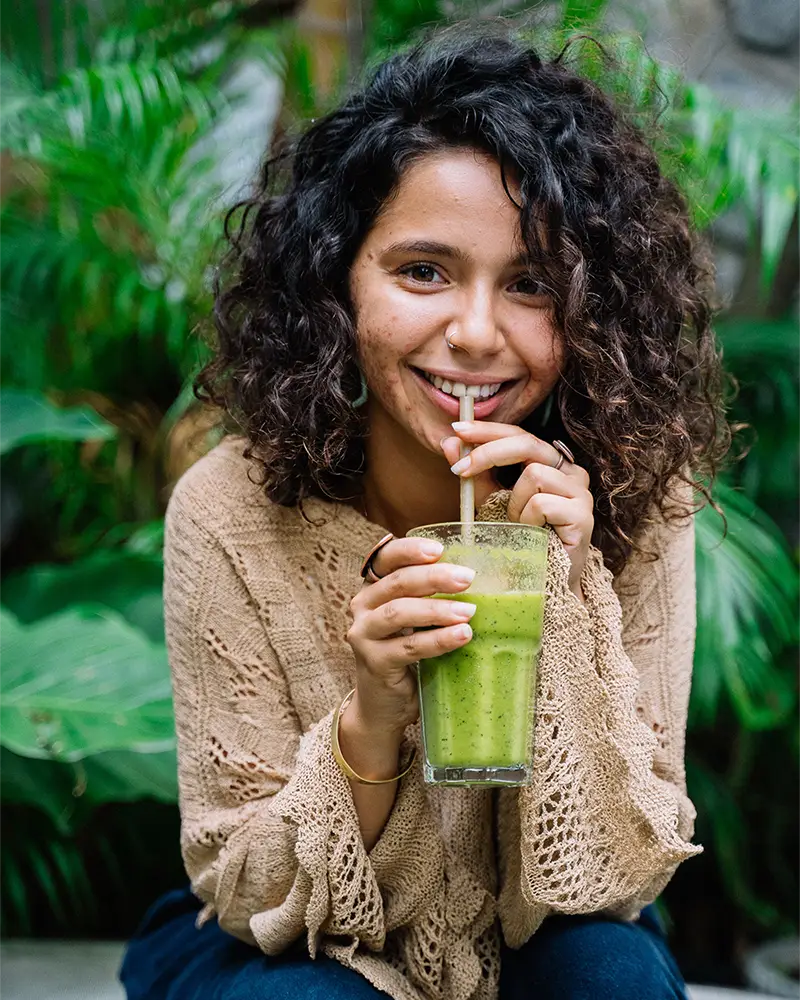 woman drinking smoothie