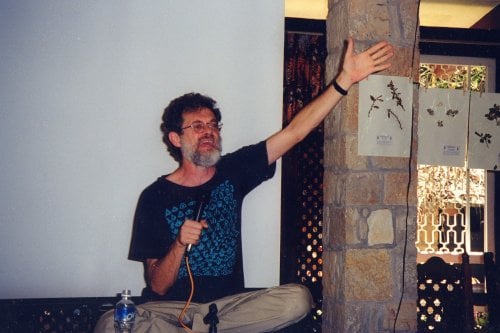 Terence McKenna speaking into microphone
