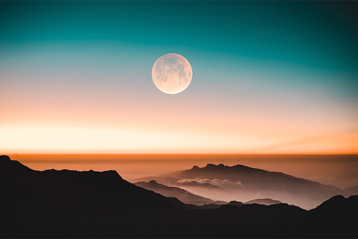 image of moon over mountains