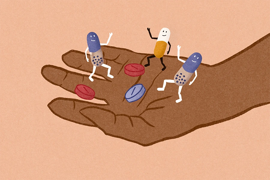 illustration of hand holding pills