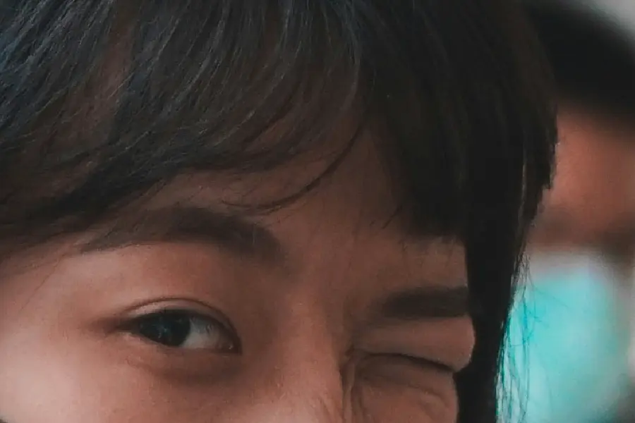 Image Depicting Close Up Shot of Person Winking
