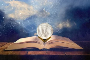 Collage of Open Book with Fairy Dust and Crystal Ball
