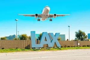 Photo of LAX Sign and Airplane