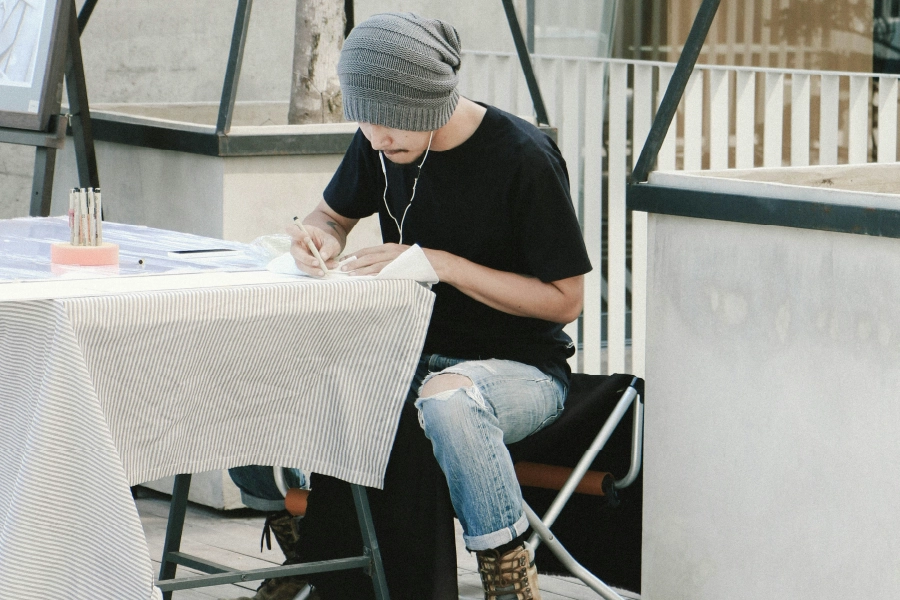 Man drawing outside