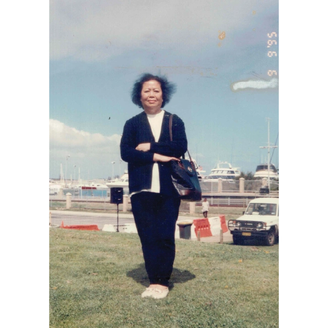 Photo of Older Woman Standing in Grass